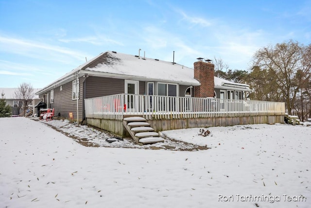 2187 Riley St, Hudsonville, MI 49426 - snow covered house with a chimney