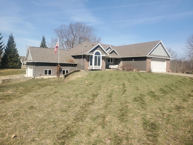 ranch-style house with brick siding, an attached garage, and a front yard