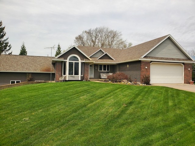 2187 Riley St, Hudsonville, MI 49426 - ranch-style home featuring brick siding, driveway, a front yard, and a garage