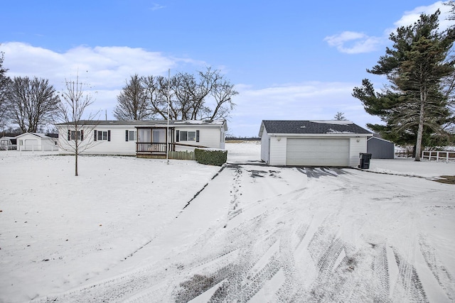 view of front of house with an outbuilding and a garage