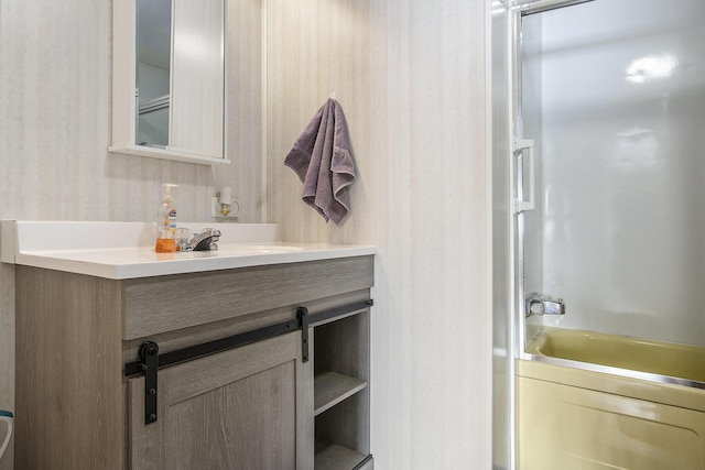 bathroom featuring vanity and tub / shower combination