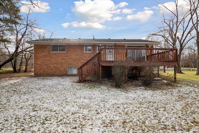 back of house featuring a deck