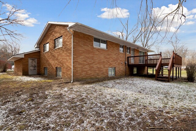 view of property exterior with a deck