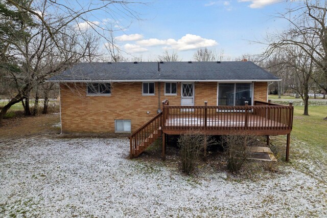 rear view of property with a deck