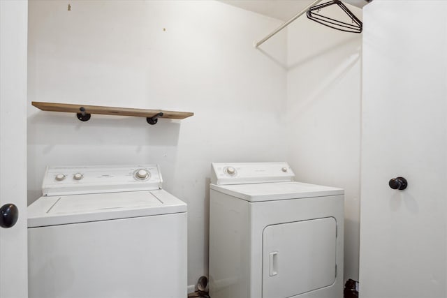 laundry room featuring separate washer and dryer