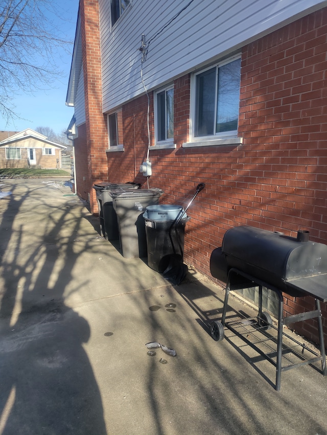 view of side of property with a patio