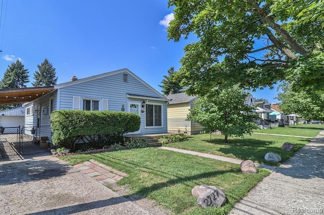 view of front of house featuring a front yard and a carport