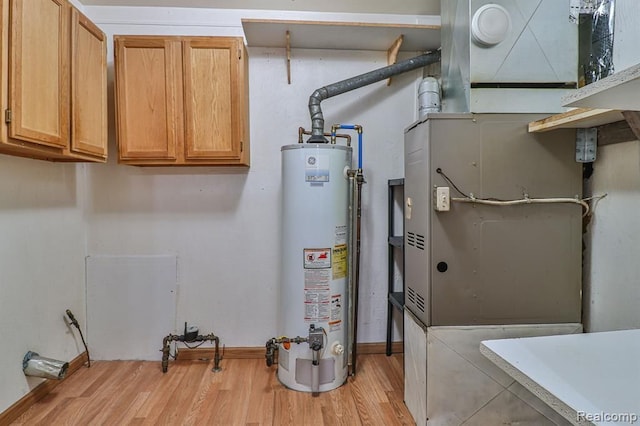 utility room with gas water heater