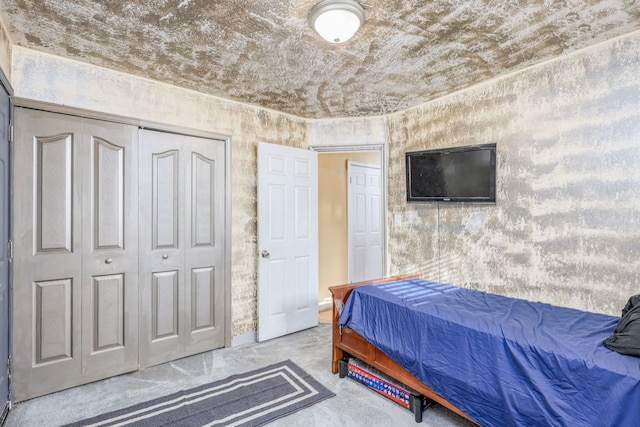 carpeted bedroom featuring a closet