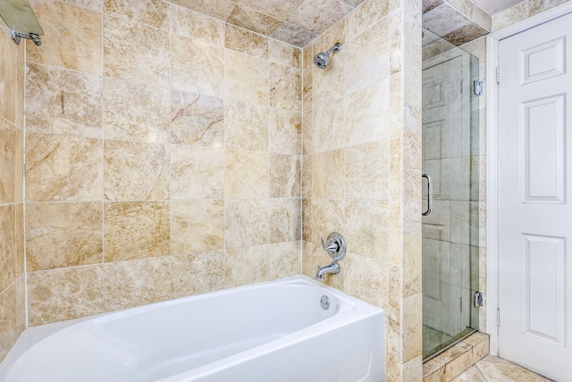 bathroom featuring separate shower and tub