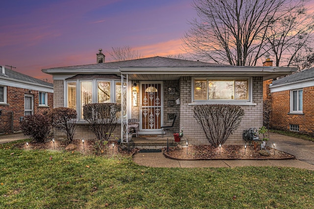 view of front of home with a yard