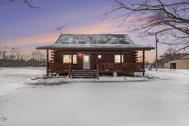 cabin featuring covered porch