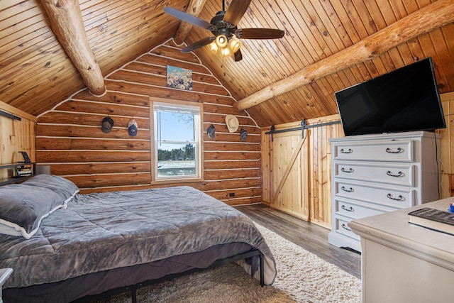 bedroom with dark hardwood / wood-style floors, a barn door, wood ceiling, and ceiling fan