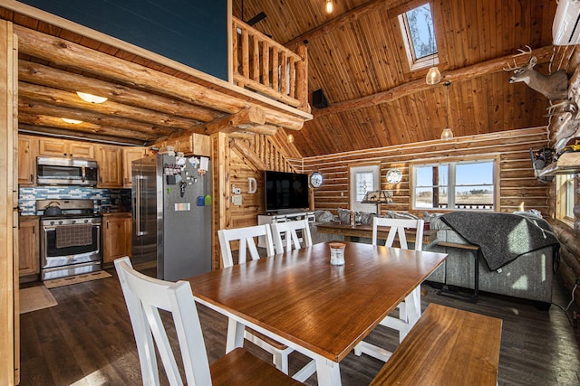 dining space featuring rustic walls, a skylight, high vaulted ceiling, and dark hardwood / wood-style floors