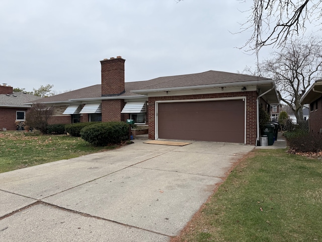 view of front of house featuring an attached garage, a chimney, a front lawn, and brick siding