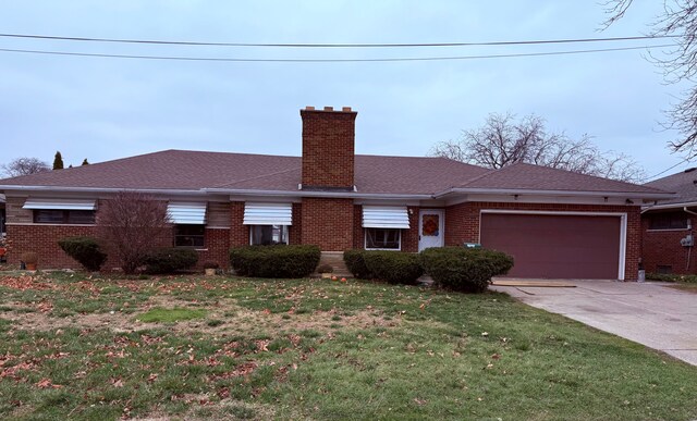 ranch-style house with a front yard and a garage