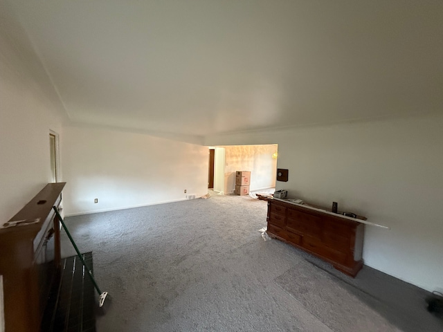 unfurnished living room with carpet flooring