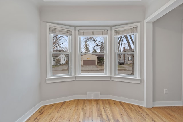 unfurnished room featuring wood-type flooring