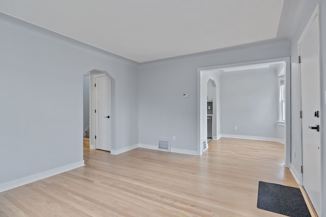 empty room with light hardwood / wood-style floors