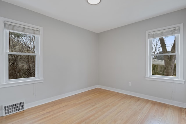 spare room with light wood-type flooring