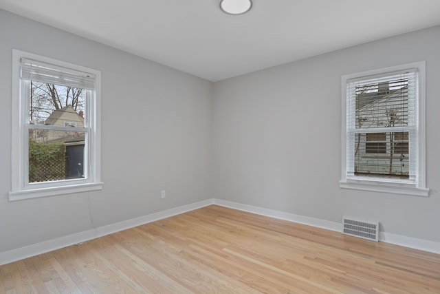 spare room featuring light wood-type flooring