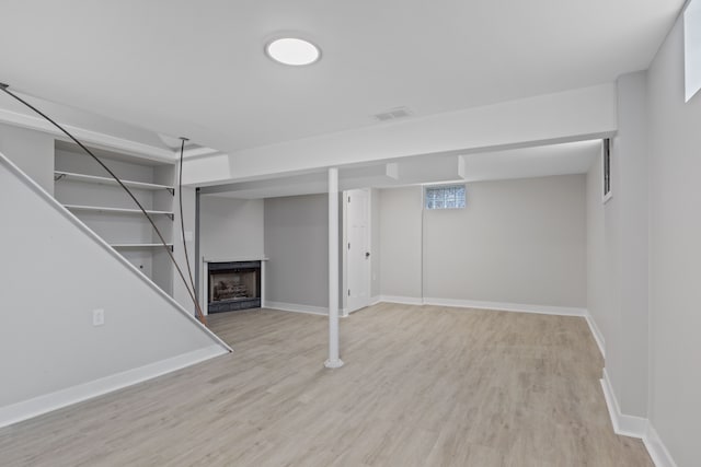 basement with light wood-type flooring