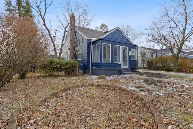 view of front of house with a sunroom