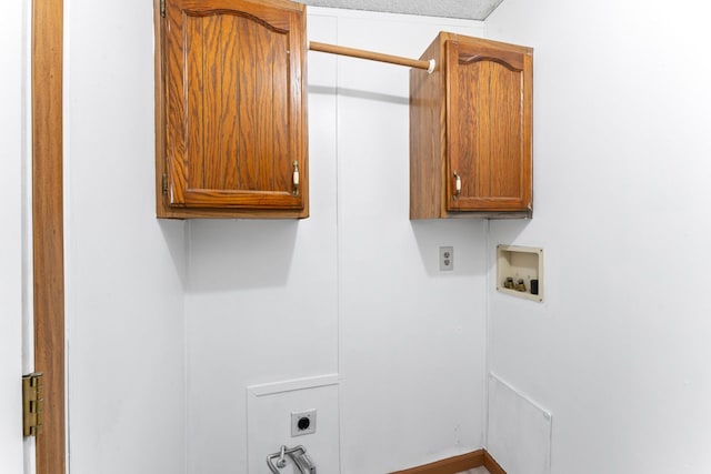 laundry room featuring cabinets, hookup for a washing machine, and electric dryer hookup