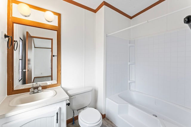 full bathroom with vanity, toilet, tiled shower / bath, and crown molding