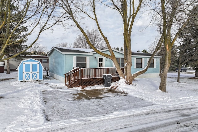 view of front of house featuring a shed and a wooden deck