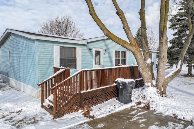 exterior space featuring a wooden deck