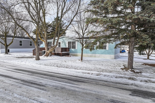 view of front of property with a wooden deck