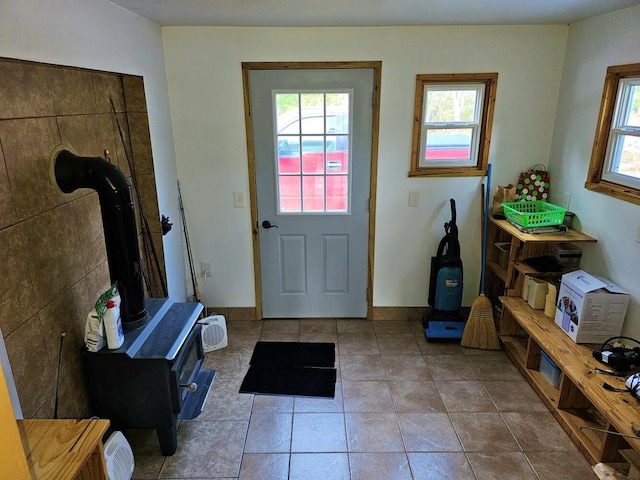 doorway featuring a wealth of natural light and tile patterned floors