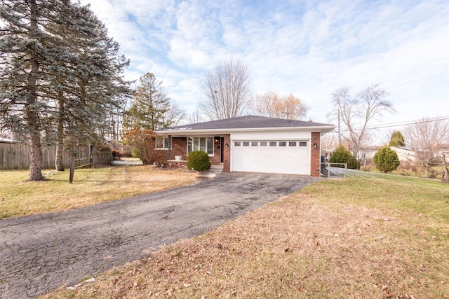 single story home with a garage and a front yard