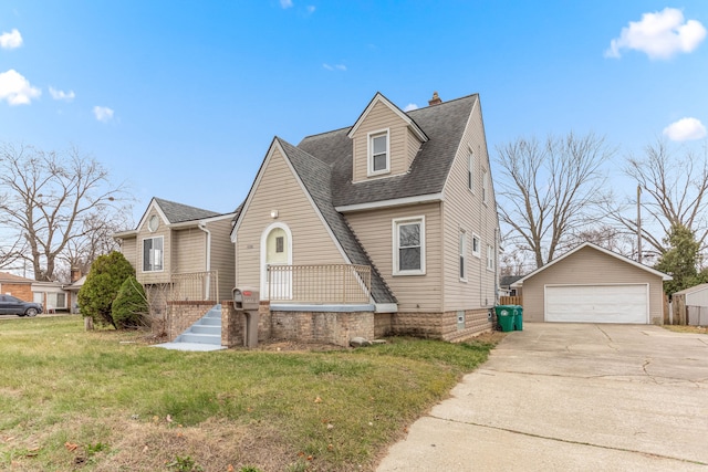 view of front of property featuring a front lawn, an outdoor structure, and a garage