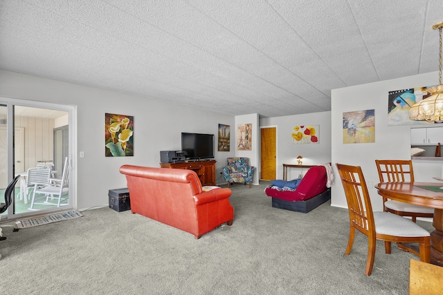 carpeted living room featuring a textured ceiling and an inviting chandelier