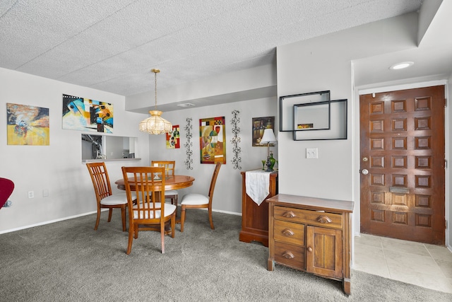 dining room with light carpet, a textured ceiling, and a notable chandelier