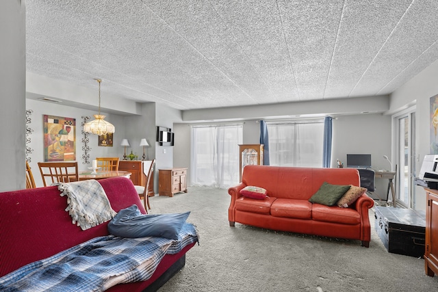 living room with carpet flooring and a textured ceiling