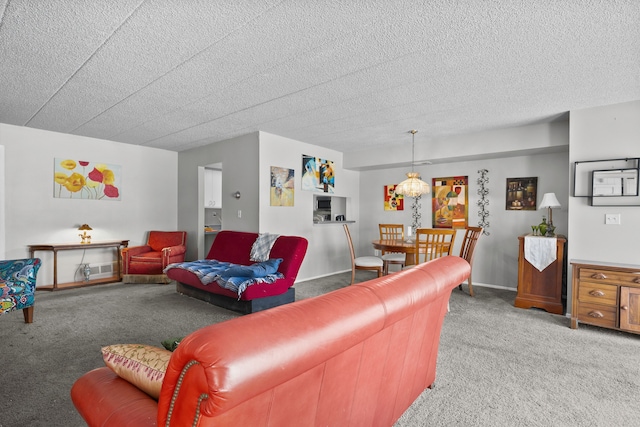 carpeted living room with a textured ceiling