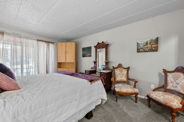 carpeted bedroom featuring a textured ceiling