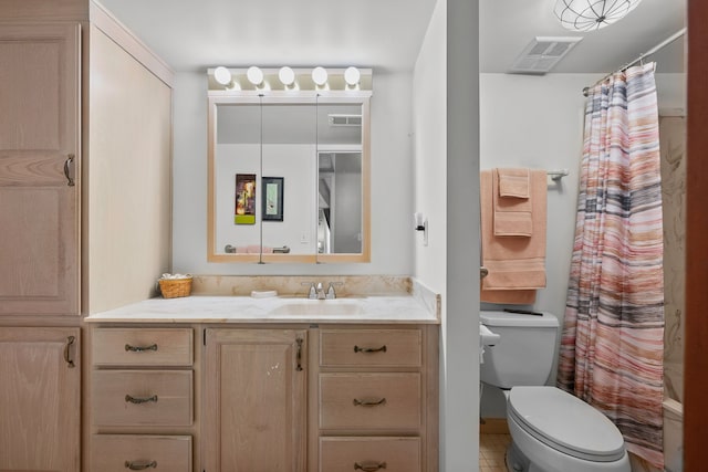 full bathroom featuring tile patterned flooring, vanity, toilet, and shower / bathtub combination with curtain