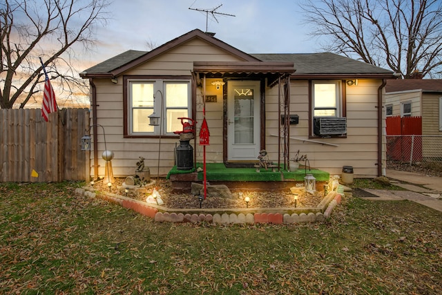 bungalow-style home featuring a yard