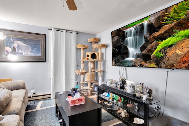 living room featuring baseboard heating and ceiling fan