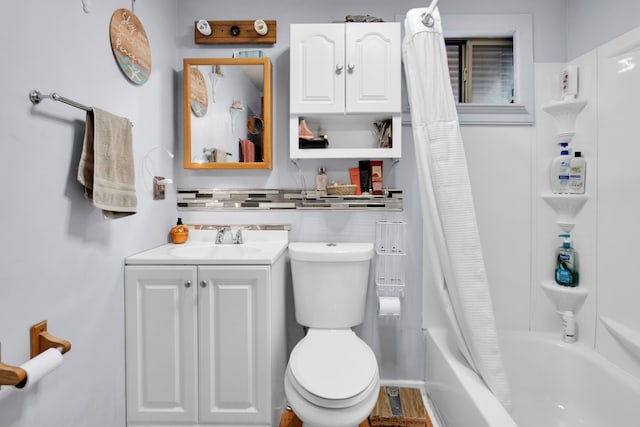 full bathroom featuring shower / bath combination with curtain, toilet, and vanity