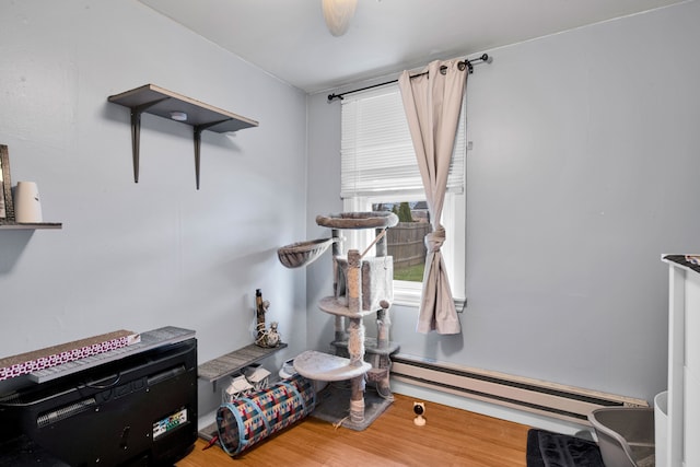 interior space featuring hardwood / wood-style floors and a baseboard radiator