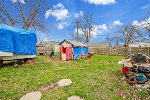 view of yard with a storage unit