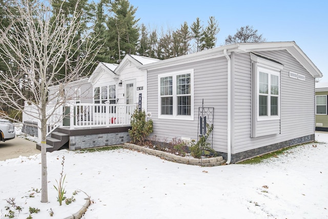 view of front of house featuring a wooden deck