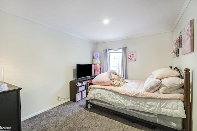 bedroom with carpet floors and crown molding