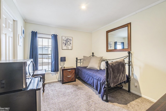 carpeted bedroom featuring crown molding