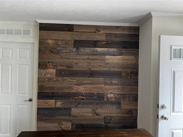 room details with crown molding and a textured ceiling